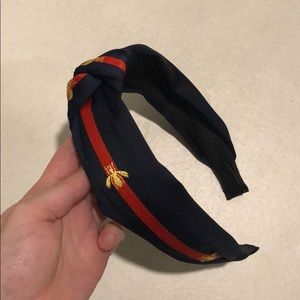 Navy and red headband with bumble bees on it!